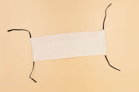 DIY Handmade eco friendly reusable white cotton face mask helps to stop the spread of the viruses. COVID-19 pandemic conceptの写真素材