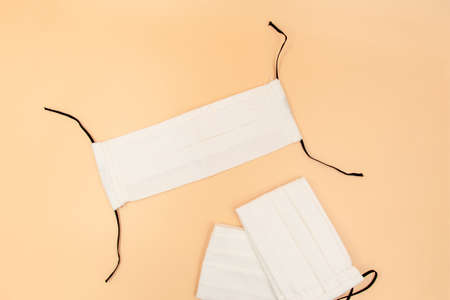 DIY Handmade eco friendly reusable white cotton face mask helps to stop the spread of the viruses. COVID-19 pandemic conceptの写真素材