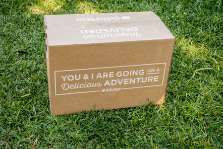 Sydney, Australia 2020-05-09 Hello Fresh meal kits delivered in a box on a green grass