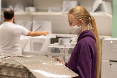 A girl wearing handmade protection mask in department store during COVID-19 pandemicのeditorial素材