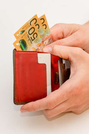 Hands holding leather wallet with australian dollars. Finance concept