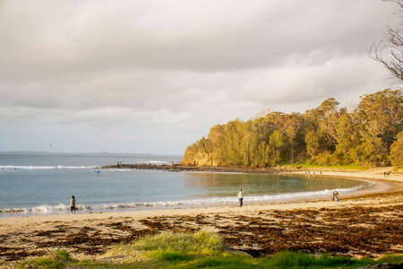 Bendalong, Australia 2020-06-07 People fishing in the ocean on a sandy Boat Harbour Beach, Bendalong, NSWのeditorial素材