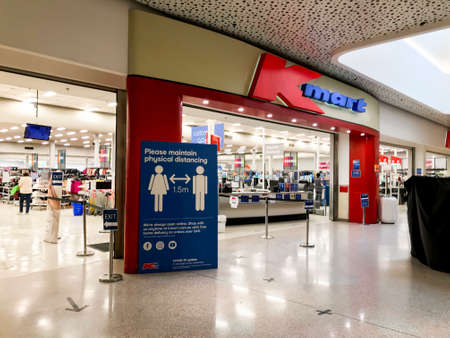 Sydney, Australia 2020-04-08: A sign about physical social distancing at the entrance to Kmart...