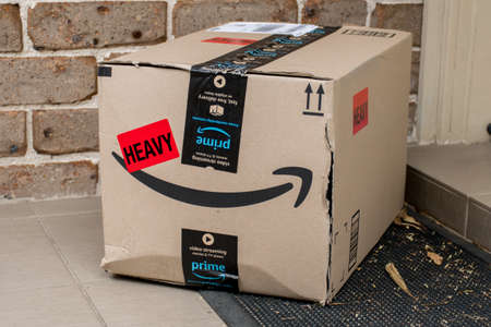 Sydney, Australia - 2020-10-17 Amazon prime boxes and envelopes delivered to a front door of residential buildingのeditorial素材