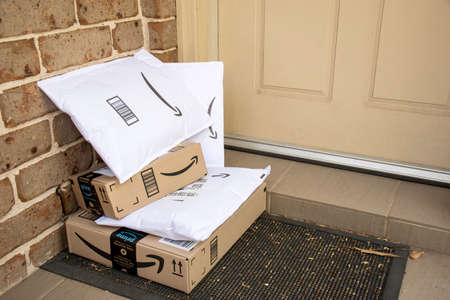 Sydney, Australia - 2020-10-17 Amazon prime boxes and envelopes delivered to a front door of residential buildingのeditorial素材