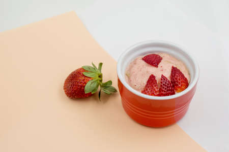 Banana nice cream with strawberries. Gluten free and dairy free healthy dessert. Blend frozen banana until smooth and add some strawberriesの写真素材
