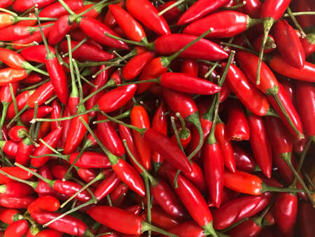 Fresh birdseye chilli piled on the market. Food background. Harvest. Food background. Harvest