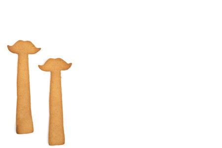 Homemade gingerbread cookies moustache isolated on a white background. Empty space for text inputの写真素材
