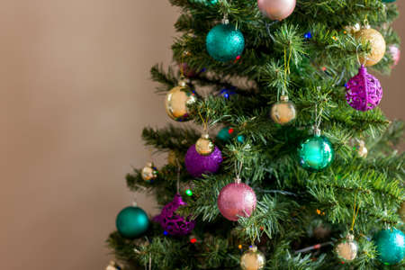 Blurred Christmas tree decorated with ornaments balls baubles. Magic of Christmas. Family festive tradition. Empty space for text inputの写真素材