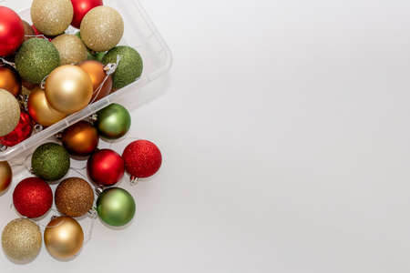 Christmas balls in a plastic transparent boxes ready to decorate a Christmas tree. Celebration conceptの写真素材