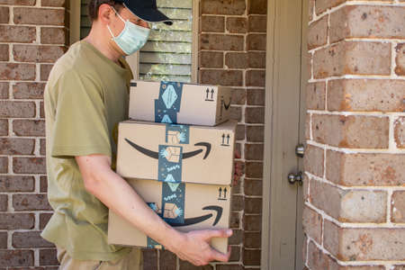 Sydney, Australia - 2020-10-17 Amazon prime boxes and envelopes delivered to a front door of residential buildingのeditorial素材