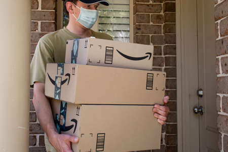 Sydney, Australia - 2020-11-29 Amazon prime boxes and delivered to a front door of residential building during the COVID-19 pandemic.のeditorial素材