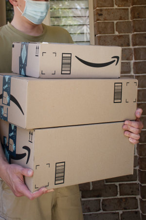 Sydney, Australia - 2020-11-29 Amazon prime boxes delivered to a front door of residential building during the COVID-19 pandemic.のeditorial素材
