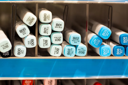 Sydney, Australia 2020-12-12 Alcohol-based Copic sketch markers on display in a shelf at stationery art supplies shop. Selective focus with blur.のeditorial素材
