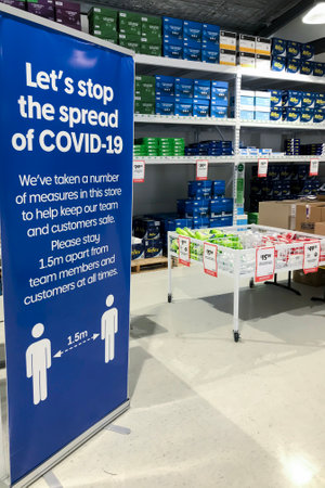 Sydyney, Australia - 2020-11-28 Let's stop the spread of COVID-19 - banner at Officeworks stationery store.のeditorial素材