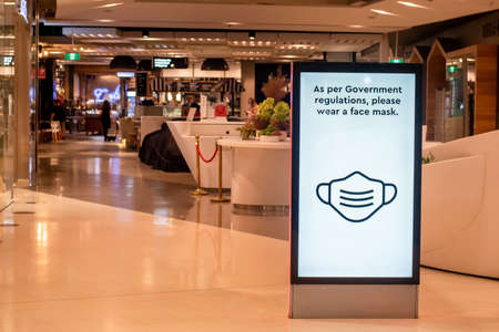 Sydney, Australia - 2020-01-14 Wearing face masks in shopping centres are compulsory in some australian states. As per Government regulations, please wear a face maskのeditorial素材