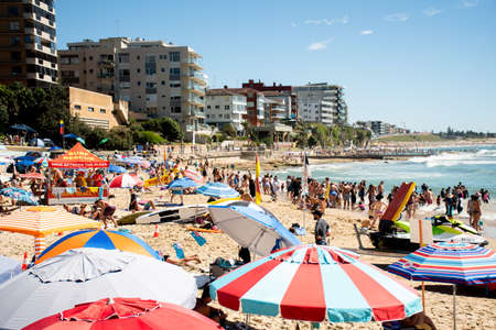 Sydney, Australia 2021-01-26 Extremely overcrowded Cronulla beach on Australia day. Umbrellas on the beach. Australian lifestyleのeditorial素材