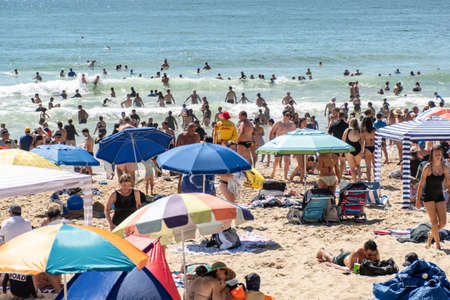 Sydney, Australia 2021-01-26 Extremely overcrowded Cronulla beach on Australia day. Umbrellas on the beach. Australian lifestyleのeditorial素材