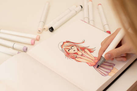 Hand drawing a cute girl anime style sketch with alcohol based sketch drawing markers.の写真素材