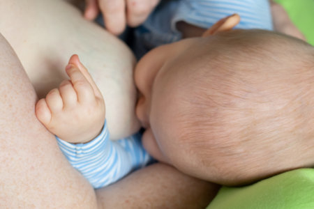 Caucasian mother breastfeeding a baby boy. Maternity love babycare family conceptの写真素材