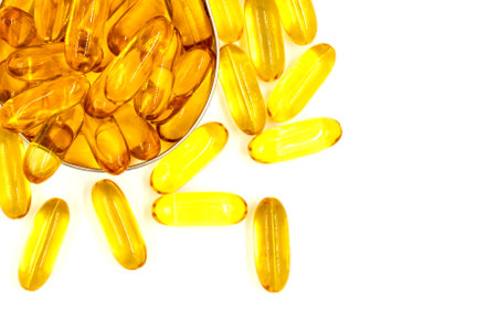 Omega-3 fish oil capsules on white background. Vitamins and supplementsの写真素材
