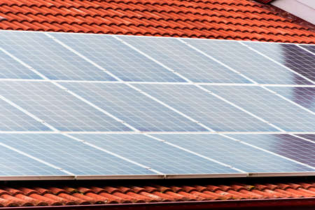 Solar panels on the roof of resedential building. Renewable solar energy.