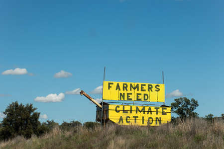 Farmers need climate action - sign on the road side in Australia. Farmers for Climate Action is a movement of more than 5000 farmers, agricultural leaders and rural Australiansの写真素材