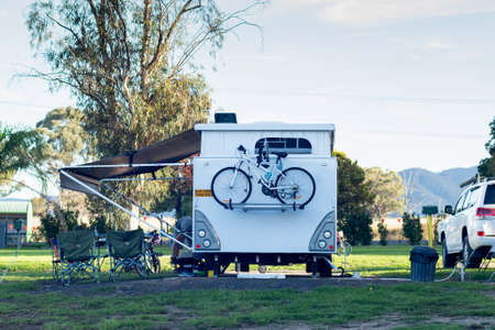 RV caravan camping on a campsite at the caravan park. Camping vacation travel conceptの写真素材