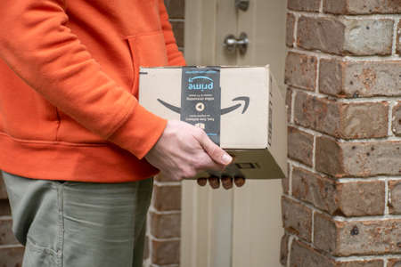 Sydney, Australia - 2020-05-24 Amazon prime boxdelivered to a front door of residential building.のeditorial素材
