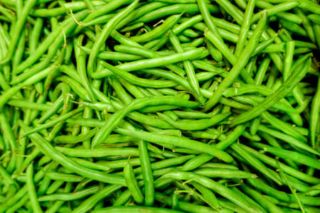Fresh green beans piled on the market. Food background. Harvest. Healthy eating. Vegan and vegetarianの写真素材