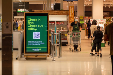 Sydney, Australia 2021-01-07: Exterior view of Woolworths Miranda supermarket during the COVID-19 pandemic lockdown. Check in advertisementのeditorial素材