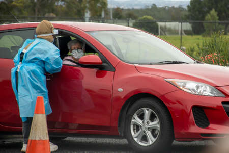 Barden Ridge, Australia - 2021-07-10 Medical stuff making covid test swab at COVID-19 drive through testing clinic. NSW, Australiaのeditorial素材