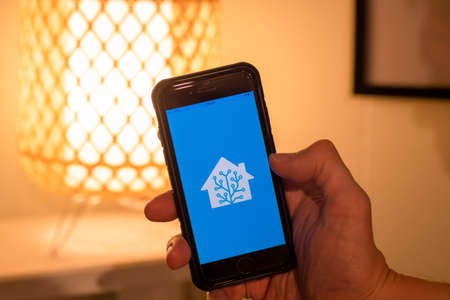 Sydney, Australia - 2021-03-06 Home assistant application on the moblie phone screen. Open source home automation that puts local control and privacy firstのeditorial素材