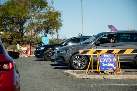 Barden Ridge, Australia - 2021-07-10 Medical stuff making covid test swab at COVID-19 drive through...