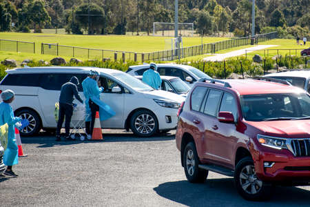 Barden Ridge, Australia - 2021-07-10 Medical stuff making covid test swab at COVID-19 drive through testing clinic. NSW, Australiaのeditorial素材