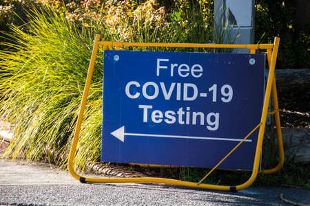 Free COVID-19 testing. Virus testing clinic sign on the streetの写真素材