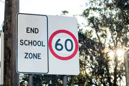 End school zone road sign with speed limit 60 in Australia. Road safety conceptの写真素材