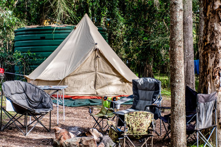 Family tent setup at the campsite surrounding by nature in caravan holiday parkの写真素材