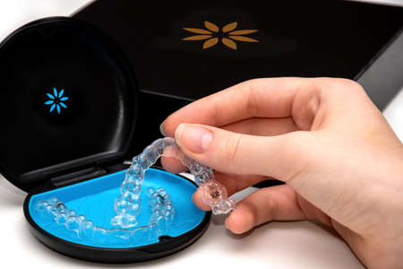 Sydney, Australia, 2021-08-23 Invisalign aligners in a box. Invisible bracers. Clear teeth...