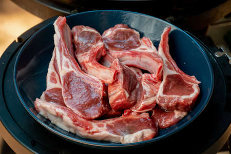 Raw lamb cutlets ready for barbecue grill. Backyard BBQ cooking. Australia Day celebration party mealの写真素材
