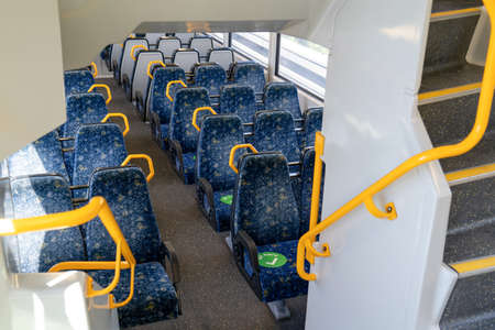 Sydney train carriage with stickers sit hear on seats for social distancing during Covid-19 pandemic. Tangara carriageの写真素材