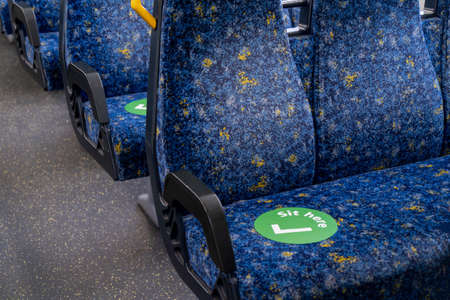 Sydney train carriage with stickers sit hear on seats for social distancing during Covid-19 pandemic. Tangara carriageの写真素材