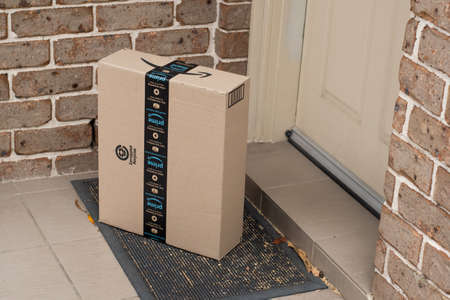 Sydney, Australia - 2021-10-30 Amazon prime box delivered to a front door of residential building....