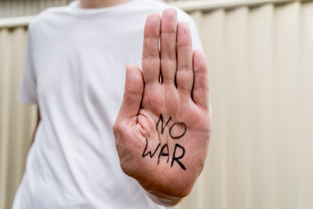 No war message written on hand. Russian Ukraine war conflict confrontation protest. Anti war manifestation conceptの写真素材