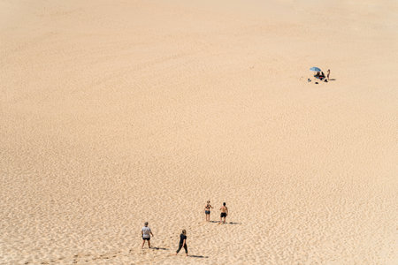 2022-02-20 Cronulla, Australia Active people walking through the sand at Cronulla Sand dunes. Background with copy space.のeditorial素材