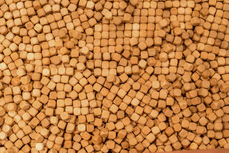 Hinoki cypress mini small wooden cubes chips for indoor sandpits sensory play playground. Wooden cubes backgroundの写真素材