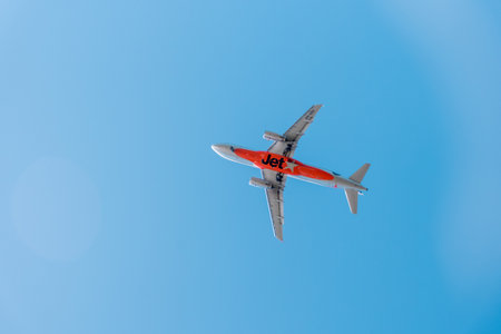 2022-05-08 Sydney, Austraia Jetstar Airways plane aircraft in the sky. Low cost carrier owned by the Qantas Group.のeditorial素材