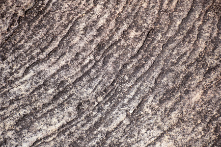 Sandstone surface rough eroded rock cliff textured natural backgroundの写真素材
