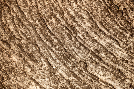 Sandstone surface rough eroded rock cliff textured natural backgroundの写真素材
