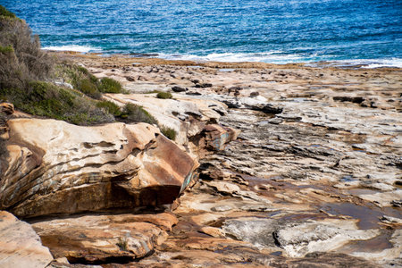 Beautiful ocean and rocky sandstone coastline view. travel destination. Royal National Park, NSW, Australia. Jibbon Loop Track.の写真素材